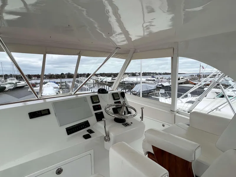 Slide: The Image of Helm of 2021 Henriques 50 Sportfisherman with marina view. - 16