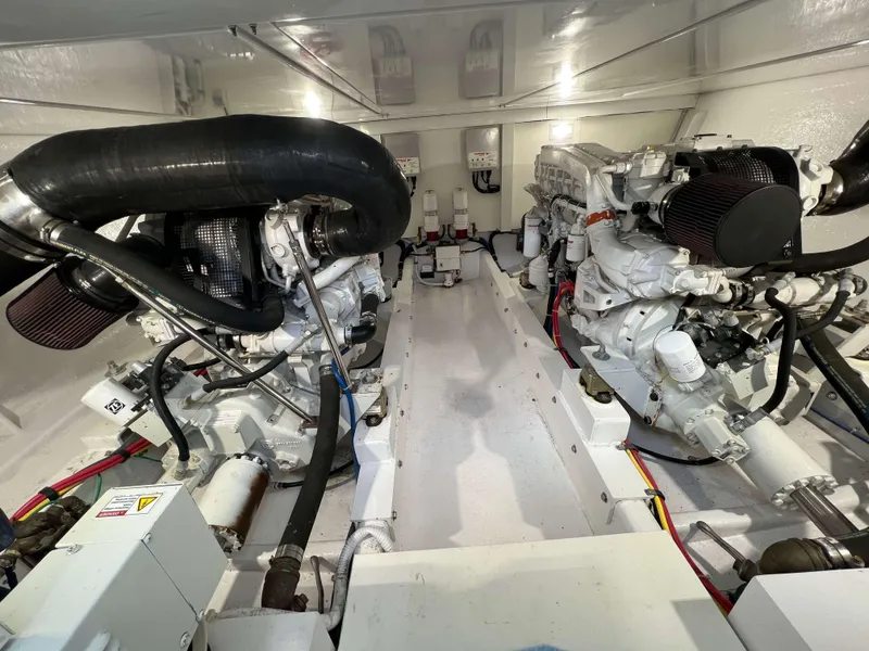Slide: The Image of Engine room of a 2021 Henriques 50 Sportfisherman boat with twin engines. - 26