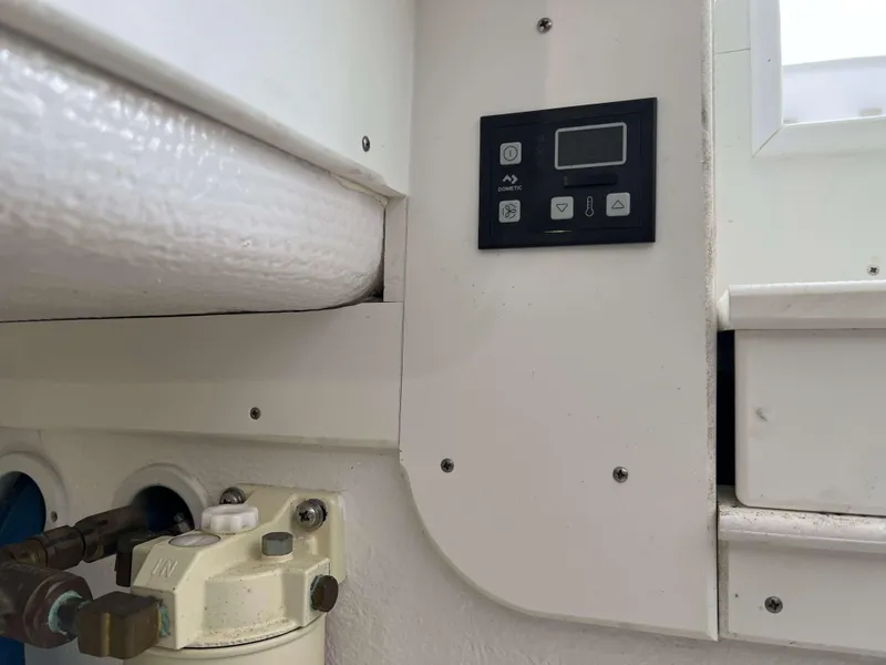 Slide: The Image of Control panel and equipment on a 2021 Henriques 50 Sportfisherman boat. - 28