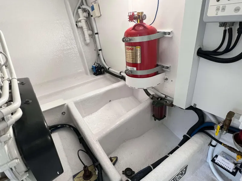 Slide: The Image of Engine room of a 2021 Henriques 50 Sportfisherman with fire extinguisher. - 32