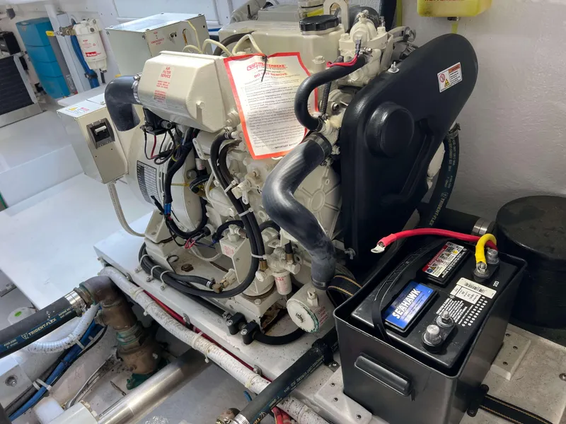 Slide: The Image of Henriques 50 Sportfisherman 2021 engine compartment with battery and wiring. - 34