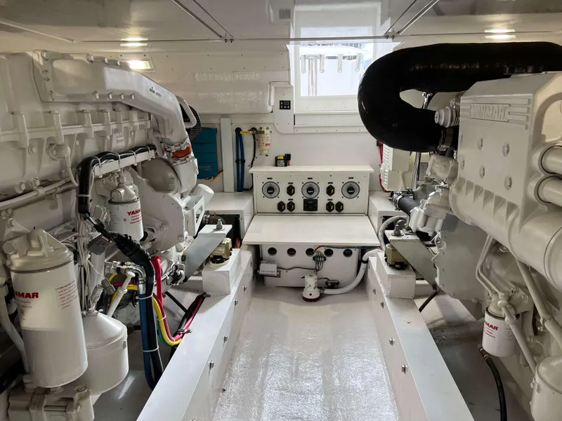 Slide: The Image of Engine room of a 2021 Henriques 50 Sportfisherman boat with Yanmar engines. - 36