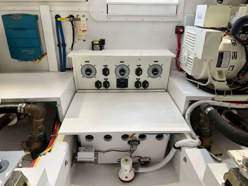 Slide: The Image of Henriques 50 Sportfisherman 2021 engine room with control panel and equipment. - 38
