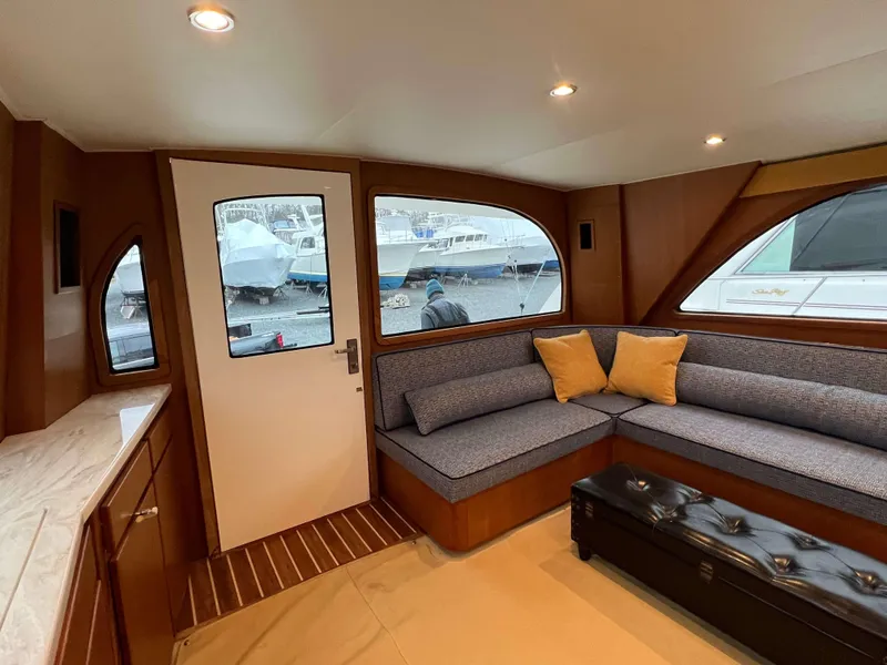 Slide: The Image of Interior of 2021 Henriques 50 Sportfisherman with cozy seating and marina view. - 41