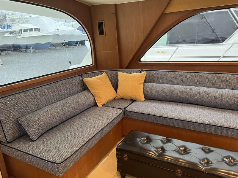 Slide: The Image of Interior of 2021 Henriques 50 Sportfisherman with cozy seating and marina view. - 42