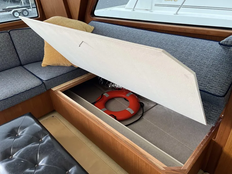 Slide: The Image of Storage compartment with life ring on 2021 Henriques 50 Sportfisherman boat. - 43