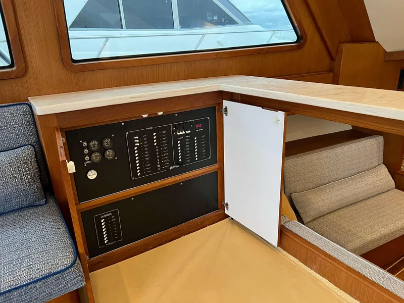 Slide: The Image of Henriques 50 Sportfisherman 2021 interior control panel and seating area. - 44