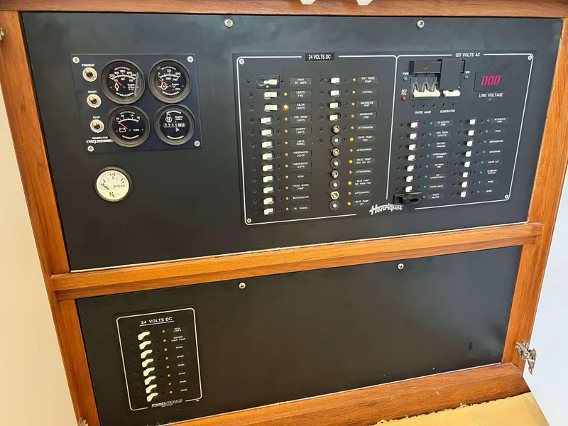 Slide: The Image of Henriques 50 Sportfisherman 2021 electrical control panel with gauges and switches. - 45
