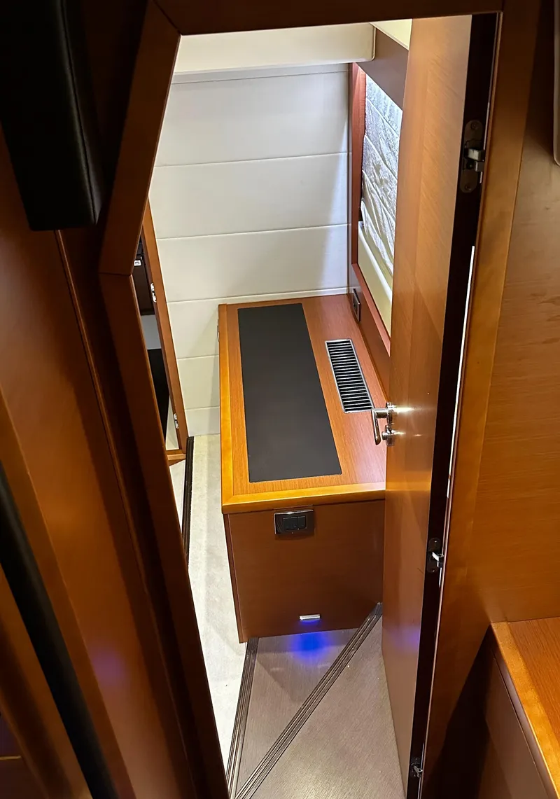 Slide: The Image of Interior view of 2013 Prestige 500 yacht cabin with wooden furnishings. - 15