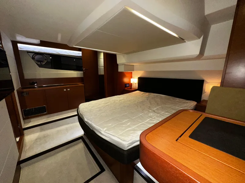 Slide: The Image of Luxurious cabin interior of a 2013 Prestige 500 yacht with modern furnishings. - 17