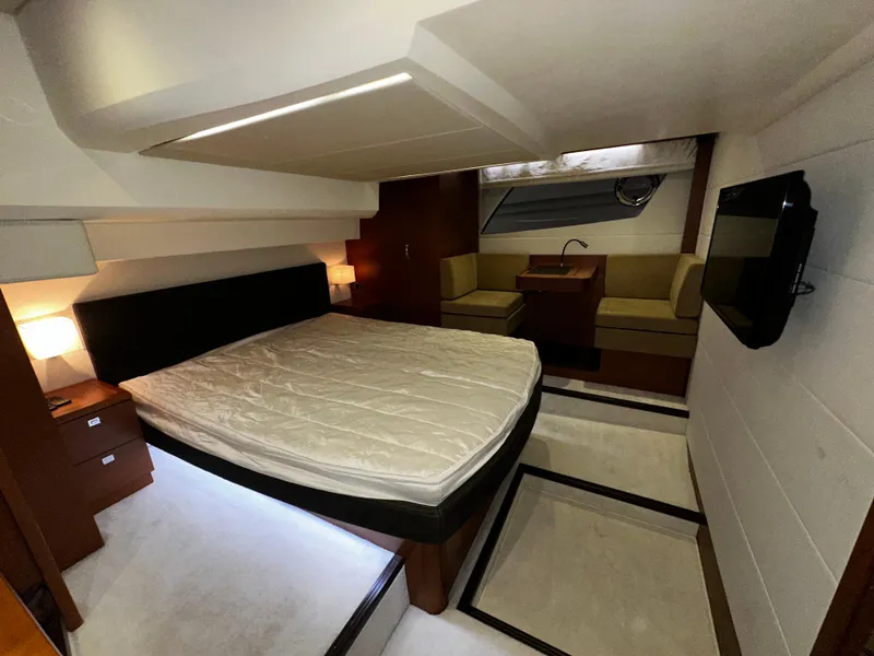 Slide: The Image of Luxurious bedroom interior of a 2013 Prestige 500 yacht with modern furnishings. - 18