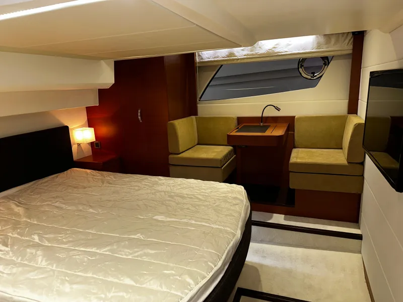 Slide: The Image of Luxurious cabin interior of 2013 Prestige 500 yacht with bed and seating area. - 19