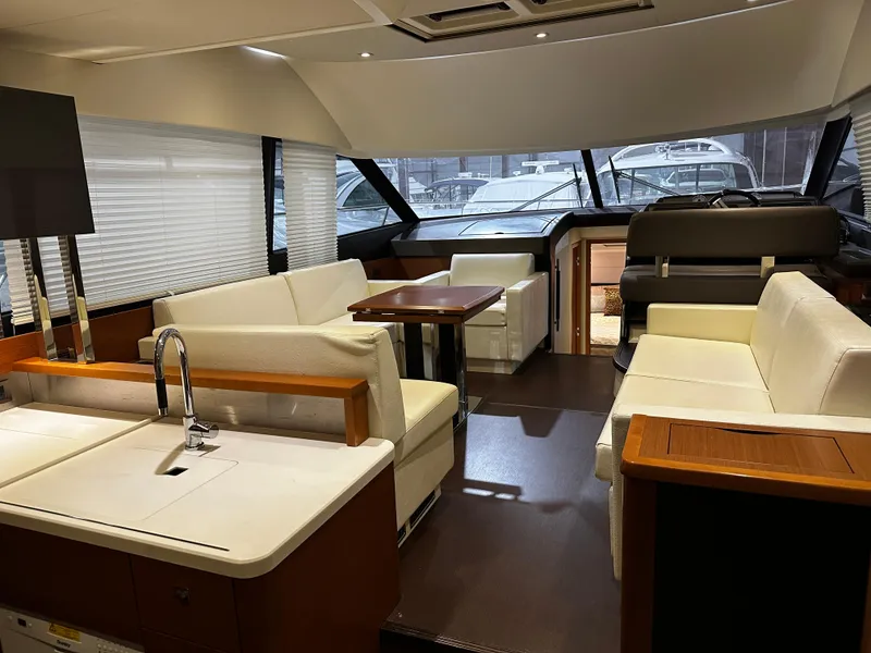 Slide: The Image of Luxurious interior of 2013 Prestige 500 yacht with modern seating and sleek design. - 2
