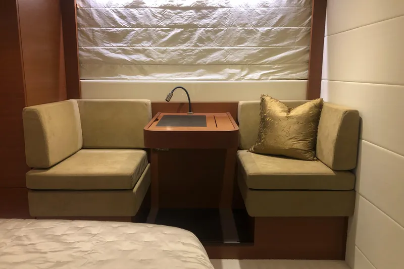 Slide: The Image of Luxurious seating area in 2013 Prestige 500 yacht with beige cushions and a small table. - 20