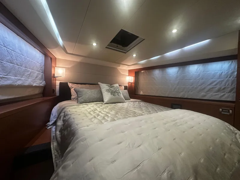 Slide: The Image of Luxurious bedroom interior of 2013 Prestige 500 yacht with elegant bedding and ambient lighting. - 23