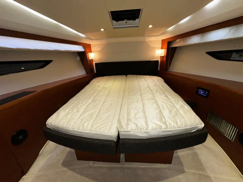 Slide: The Image of Luxurious cabin interior of a 2013 Prestige 500 yacht with a spacious bed. - 24