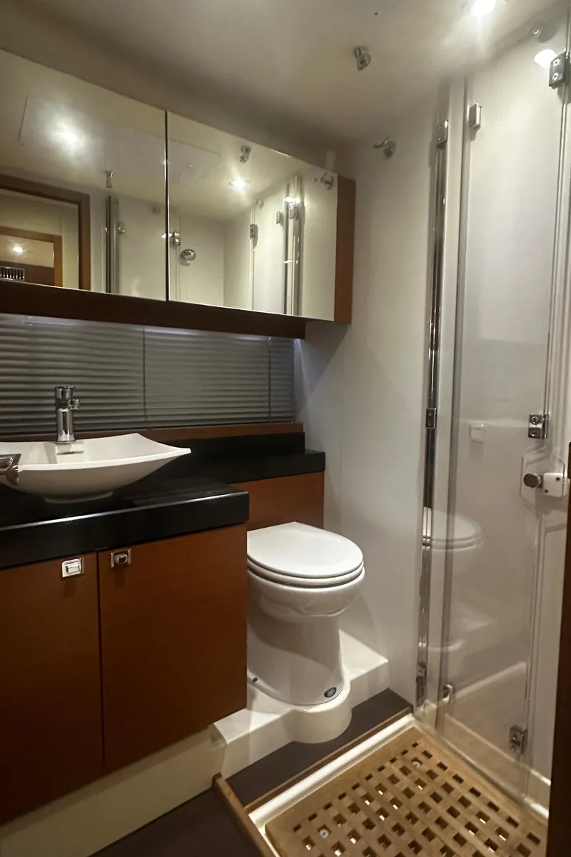 Slide: The Image of Luxurious bathroom in 2013 Prestige 500 yacht with modern fixtures and glass shower. - 27