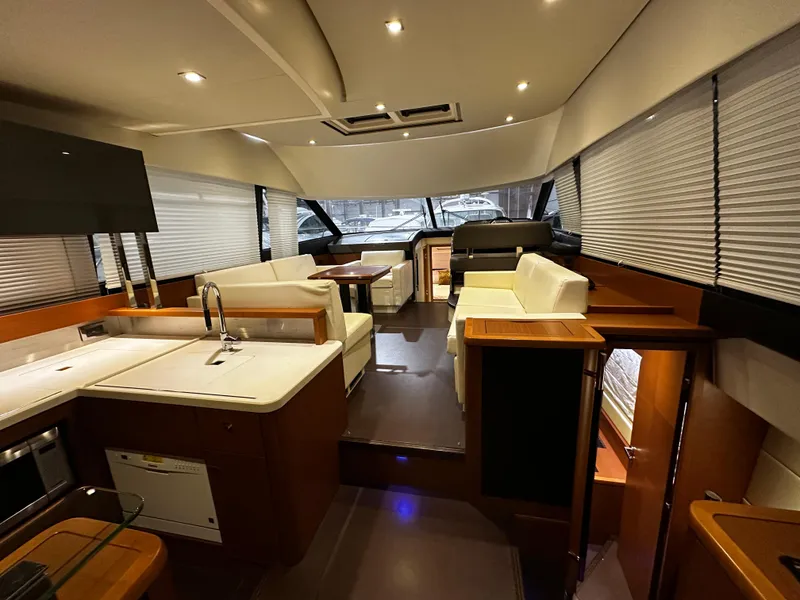 Slide: The Image of Luxurious interior of a 2013 Prestige 500 yacht with modern furnishings and ample seating. - 3
