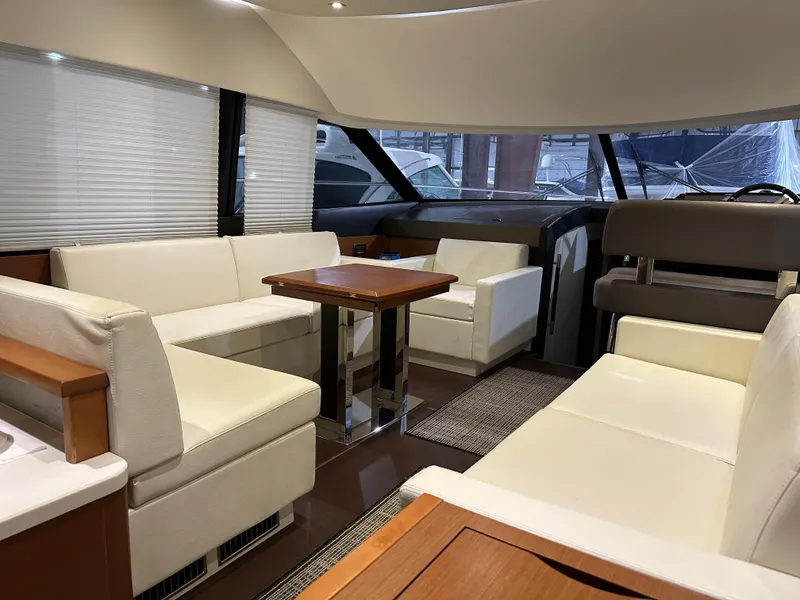Slide: The Image of Luxurious interior of a 2013 Prestige 500 yacht with white leather seating. - 4