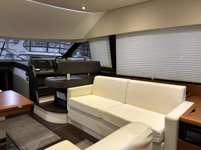 Slide: The Image of Luxurious interior of a 2013 Prestige 500 yacht with white leather seating. - 5