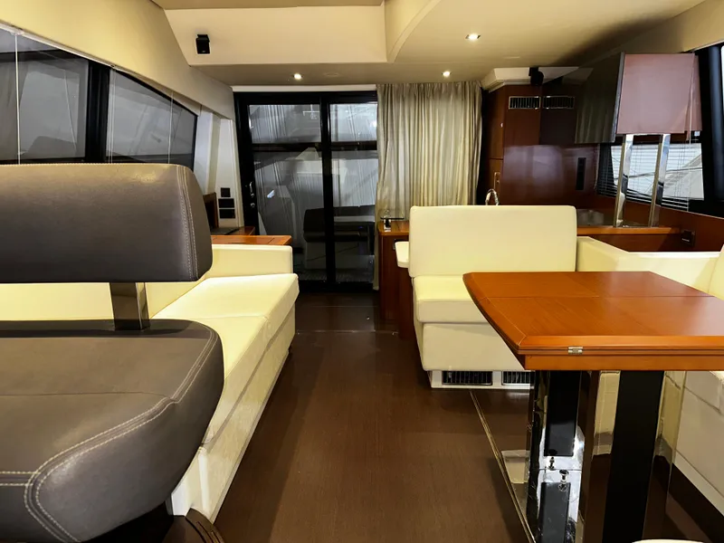 Slide: The Image of Luxurious interior of a 2013 Prestige 500 yacht with elegant seating and wooden table. - 6