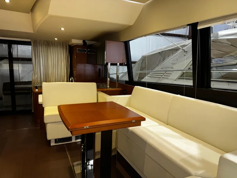 Slide: The Image of Luxurious interior of a 2013 Prestige 500 yacht with elegant seating and dining area. - 7