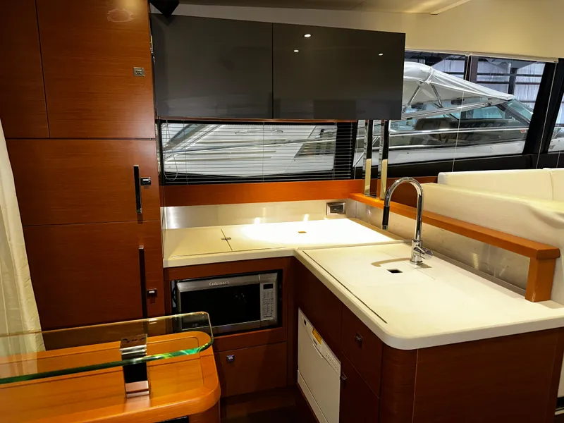 Slide: The Image of Luxurious kitchen interior of a 2013 Prestige 500 yacht with modern amenities. - 9