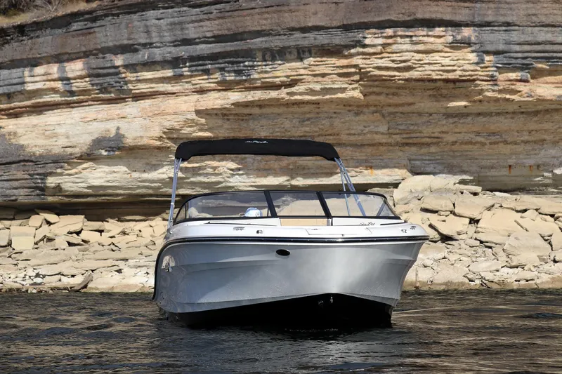 Slide: The Image of 2024 Sea Ray SPX 210 boat in front of rocky cliff. - 4