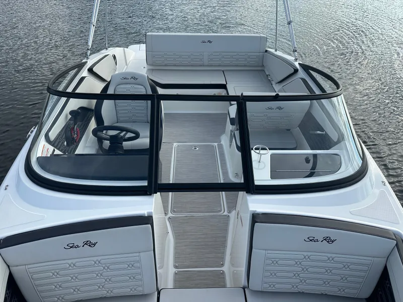 Slide: The Image of 2024 Sea Ray SPX 210 boat interior with seating and steering wheel. - 7