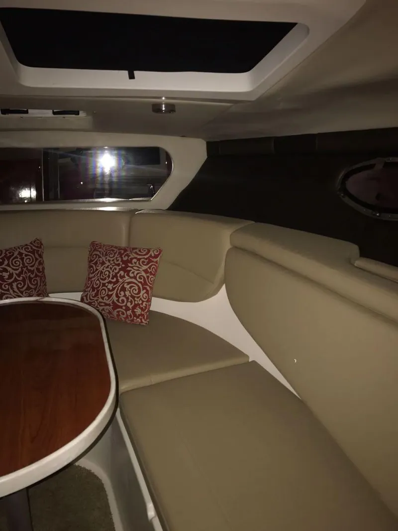 Slide: The Image of Interior of 2012 Regal 3060 Express Cruiser with beige seating. - 10