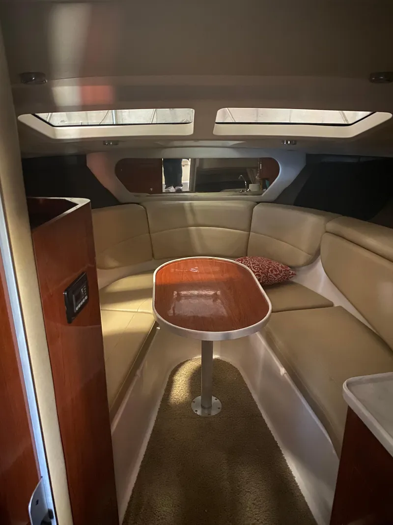 Slide: The Image of Interior of 2012 Regal 3060 Express Cruiser with seating area. - 17