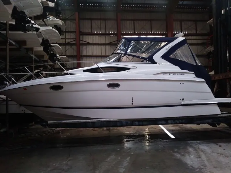 Slide: The Image of 2012 Regal 3060 Express Cruiser in a storage facility. - 2