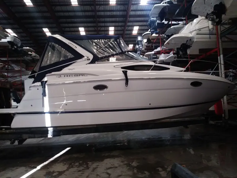 Slide: The Image of 2012 Regal 3060 Express Cruiser in storage facility. - 3