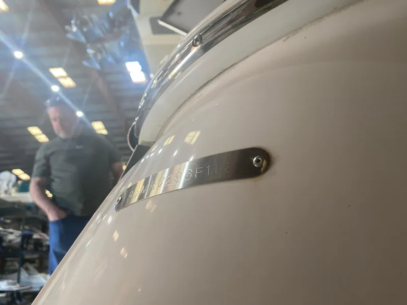 Slide: The Image of Close-up of a 2012 Regal 3060 Express Cruiser in a warehouse. - 4