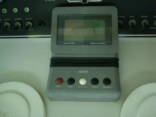 Slide: The Image of Digital compass on 1988 Chris-Craft Constellation boat dashboard with control buttons. - 3