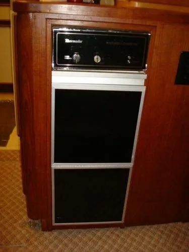 Slide: The Image of 1988 Chris-Craft Constellation boat interior with a built-in Thermador appliance. - 33