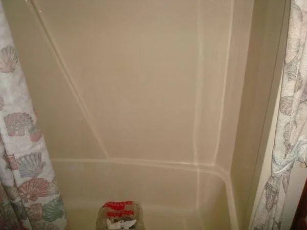 Slide: The Image of Shower area with seashell-patterned curtain, Chris-Craft Constellation 1988. - 48