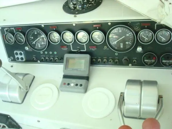 Slide: The Image of 1988 Chris-Craft Constellation dashboard with gauges and controls. - 5