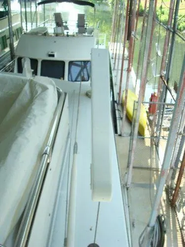 Slide: The Image of 1988 Chris-Craft Constellation yacht docked in a covered marina. - 6