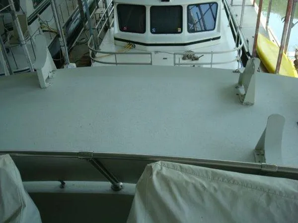Slide: The Image of 1988 Chris-Craft Constellation boat deck with railing and covered seating. - 7