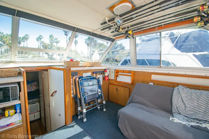 Slide: The Image of Interior of a 1976 Bertram 35 Convertible boat with seating and storage. - 12