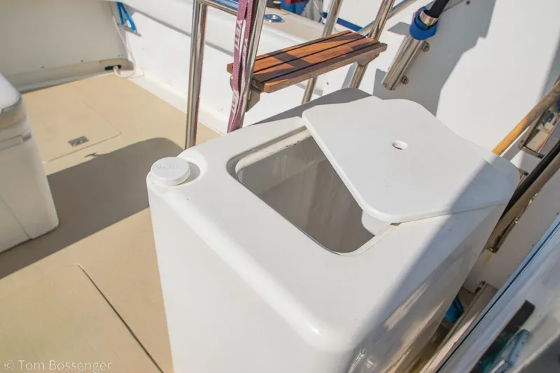 Slide: The Image of Open storage compartment on 1976 Bertram 35 Convertible boat deck. - 28