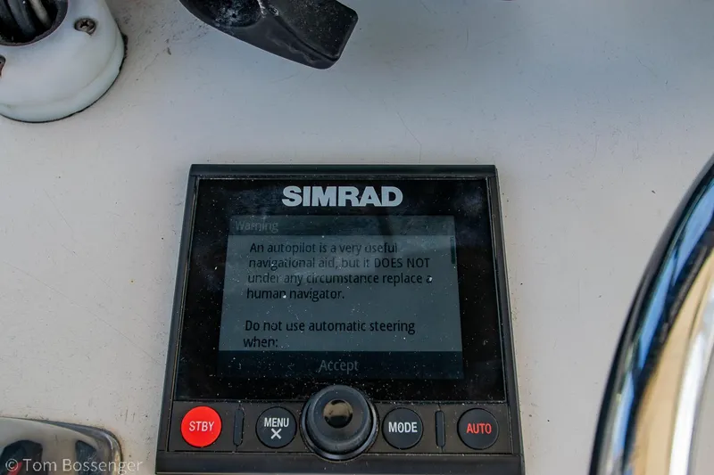 Slide: The Image of Simrad autopilot display on a 1976 Bertram 35 Convertible boat dashboard. - 32