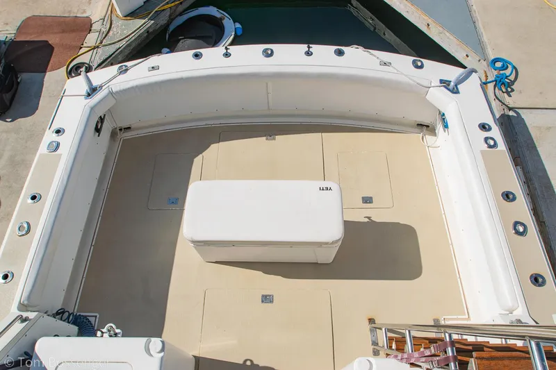 Slide: The Image of 1976 Bertram 35 Convertible boat deck with seating and storage. - 38