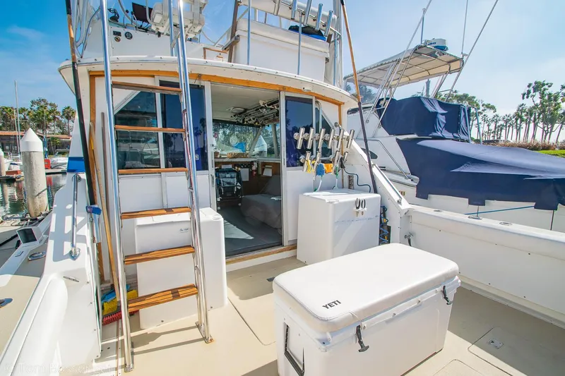 Slide: The Image of 1976 Bertram 35 Convertible yacht with fishing gear and cooler on deck. - 7