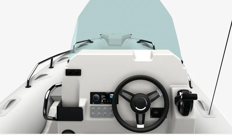 Slide: The Image of 2024 Zodiac Medline 6.8 boat dashboard with steering wheel and control panel. - 2