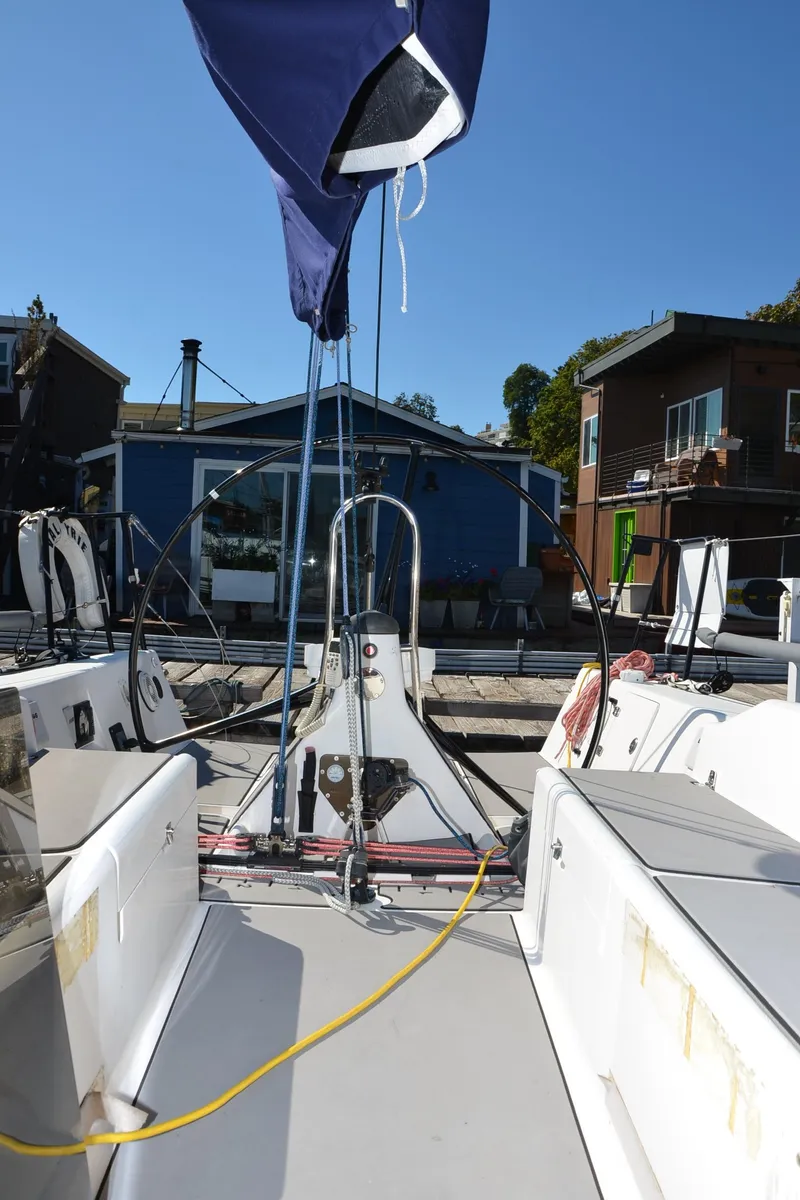 Slide: The Image of 2011 J Boats J/111 sailboat docked, showcasing deck and rigging. - 14