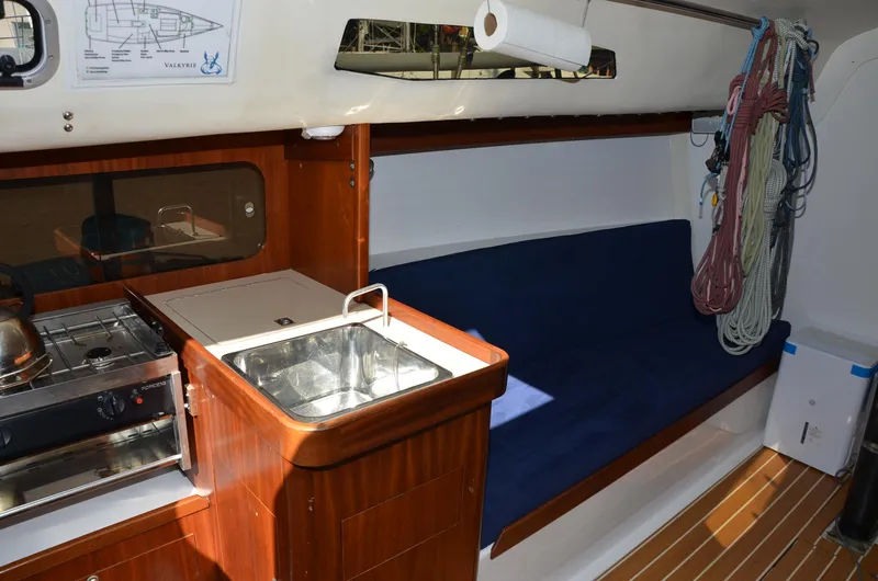 Slide: The Image of Interior of 2011 J Boats J/111 sailboat with kitchen and seating area. - 19
