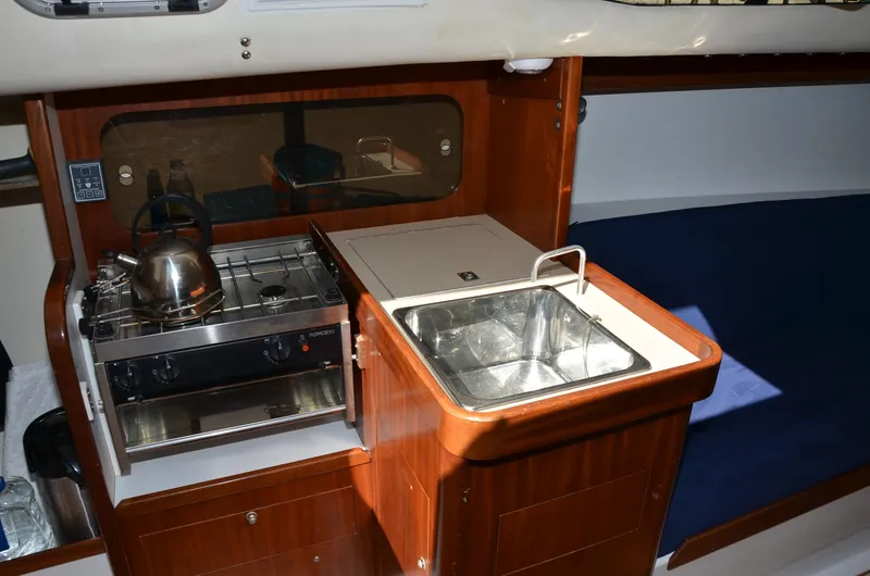 Slide: The Image of Interior of 2011 J Boats J/111 yacht with compact kitchen and sink. - 21