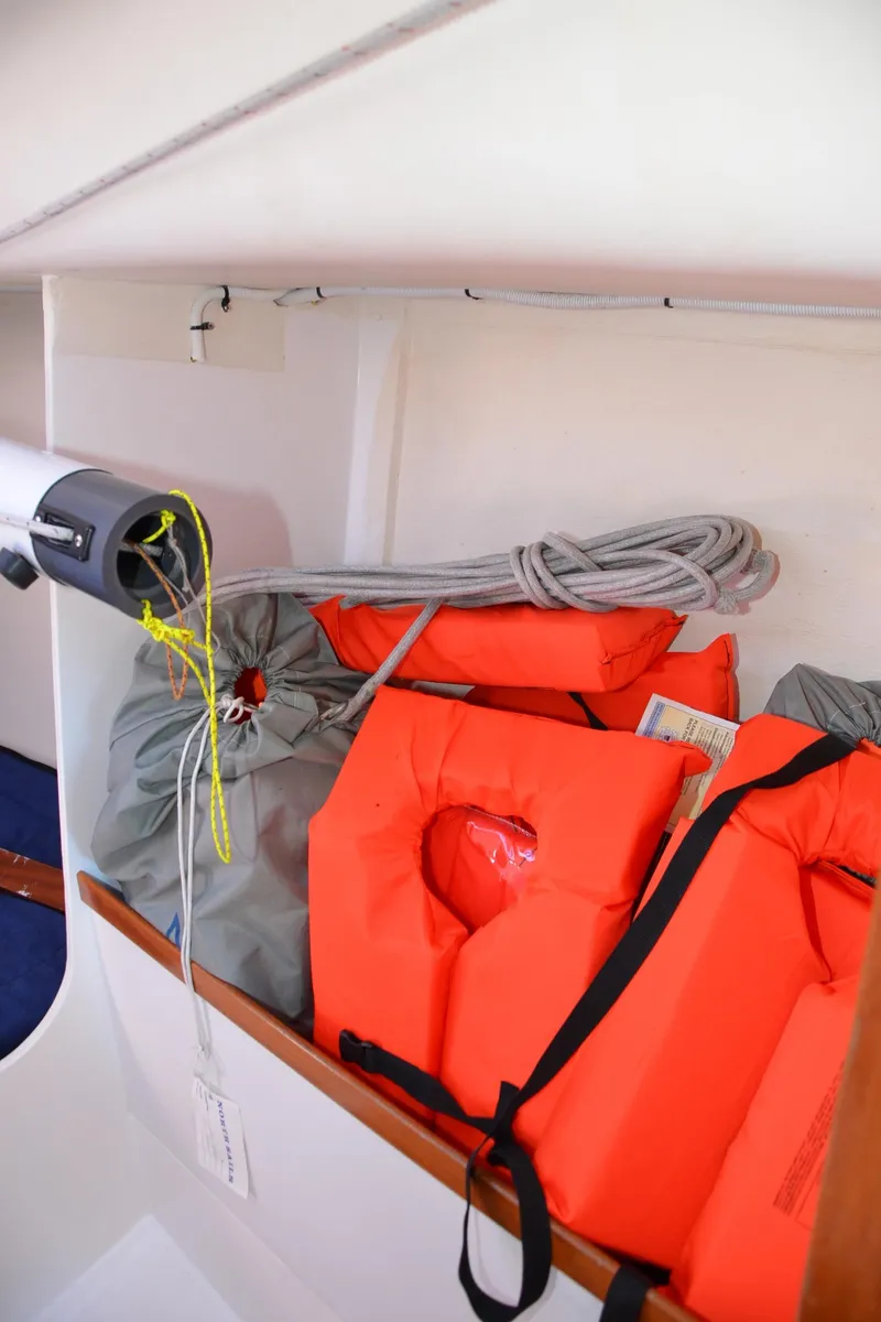 Slide: The Image of Life jackets and gear stored on a 2011 J Boats J/111 sailboat. - 27